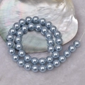 Strand of round light blue glass pearl beads for DIY necklaces on shell background - 4mm Straight Hole/Approx 100pcs Per Strand / Snow Blue