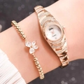 Elegant gold quartz watch with rhinestones and matching clover bracelet on wrist - Rose Gold Watch Bracelet Set