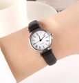 Elegant quartz watch with a black leather strap, silver case, and Roman numeral markers - Black Strap Silver Case Roman White