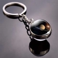 Solar system keychain with double-sided glass orb featuring Saturn in silver metal - Saturn