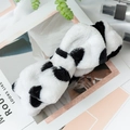 Detail of plush black and white panda headband on a lifestyle magazine background - Cow Pattern Black and White