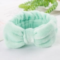 Mint green plush coral fleece headband with a large decorative bow for face washing - Fruit Green