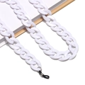 Macro shot of chunky white acrylic eyewear chain with adjustable rubber loops on a notebook - 13 Bright White