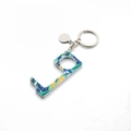 Detailed macro view of an L-shaped acrylic hygiene keychain with tropical floral prints - 2# Blue Leaves