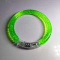 Green glowing acrylic LED bracelet with internal bubble texture on white background - Green Bubble Style