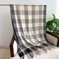 Detail of black and white plaid scarf with tassels draped on a wooden chair - Large Black & White Plaid (WT135-3)