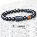 Aquarius zodiac stretch bracelet with 8mm black beads and a brown tiger eye stone - Aquarius