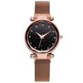 Detail view of the rose gold Milanese magnetic strap and sparkling black starry watch dial - Brown