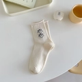 Off-white cotton mid-calf socks featuring minimalist embroidered cartoon characters - Two Dogs Beige