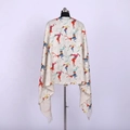 Detail of beige cashmere-like scarf featuring colorful reindeer patterns and tassel fringe - Beige - Colorful Reindeer