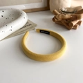 Detailed view of handmade yellow braided sponge headband with textured fabric finish - Yellow