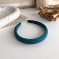 Detail of teal sponge headband with textured fabric on an elegant ins-style background - Dark Green