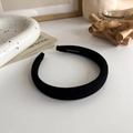 Detail of handmade black fabric sponge headband with woven interior label - Black