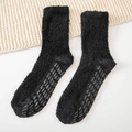 Soft black coral fleece socks with non-slip silicone grips on the bottom for home use - One Size / Black