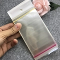 Thick transparent PE plastic bags with white hanging headers and red seal strips - 7*14 Transparent Bag
