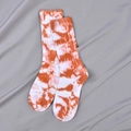 Mid-calf cotton blend crew socks featuring a vibrant orange and white tie-dye pattern design - Orange Red