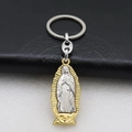 Macro detail of bimetal Virgin of Guadalupe religious keychain on black leather - Keychain (Style 2) / Steel