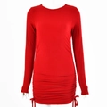 Detail view of red knitted long sleeve dress featuring side drawstring and ruched texture - Red