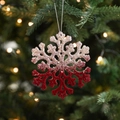 Sparkling red and silver flocked snowflake ornament hanging on a festive Christmas tree - Snowflake Type A