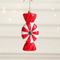 Red and white striped candy Christmas ornament with glitter and green center dot - Candy