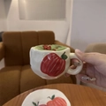 Close-up of hand-painted apple ceramic mug with matcha and matching saucer tray - Hand-painted Apple
