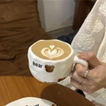 Handcrafted ceramic mug featuring a cute brown bear pattern and irregular cloud-like shape - Bear