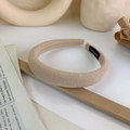 Macro detail of beige padded sponge headband featuring a hand made woven label and twill fabric - Khaki