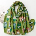 Close-up of green cotton-linen scarf featuring colorful owl patterns and frayed tassels - 180*88 / Green (SL2311-003)