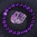 Elastic beaded amethyst bracelet featuring deep purple natural stone and raw crystal - Amethyst