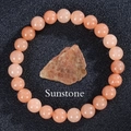 Elastic beaded bracelet featuring natural sunstone rounds and a raw mineral centerpiece - Sunstone