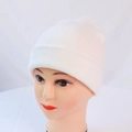 Close-up of white knitted beanie hat showing detailed texture on a mannequin head - One Size / White