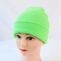 Detail view of a neon green ribbed knit beanie on a mannequin head for winter warmth - One Size / Fluorescent Green
