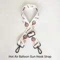 Detail of adjustable bag strap featuring colorful hot air balloon and windmill patterns - Hot Air Balloon Pattern / Gunmetal Hooks