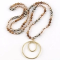 Detailed view of long beaded necklace with semi-precious stones and gold double hoop pendant - Spotted Earth Tone / Golden Double Ring