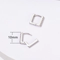 Macro detail of 10mm silver geometric square earrings with paved cubic zirconia stones - 10mm / Silver