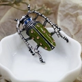Vintage beetle brooch with green enamel and amber rhinestones on a ceramic dish - DY06-Deep Green Beetle