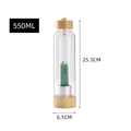 Detailed view of 550ml glass water bottle with bamboo lid and green crystal pillar inside - Aventurine Green