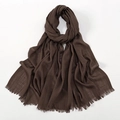 Close-up of dark brown slub cotton scarf showing soft texture and fringe edges - Coffee