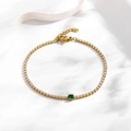 Elegant gold tennis bracelet with shimmering white zircons and a central green gemstone - Round Green Zirconia