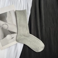 Detailed macro view of gray knitted mid-calf socks with ribbed texture on fabric - Short Light Grey