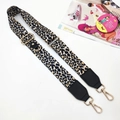 Detail of adjustable leopard print bag strap with gold metal swivel hooks and leather ends - Beige Black Leopard - Gold Buckle