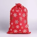 Detail of red Christmas drawstring gift bag with gold and white snowflake patterns - Red Large Snowflake