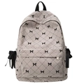 Beige corduroy backpack with black ribbon bows and diamond quilted stitching design - One Size / Gray