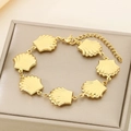 Detail of gold seashell link bracelet featuring adjustable lobster clasp and extender chain - Scallop Shape Style (KB187932-NT)