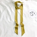 Solid yellow narrow silk scarf elegantly wrapped around a white handbag handle - 200cm / Mustard Yellow