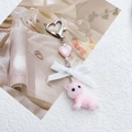 Detail of pink flocked kitten pendant with white ribbon bow and silver heart clip - Pink