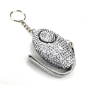 Close-up of a silver rhinestone-studded personal safety alarm keychain with a braided strap - Gray