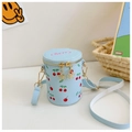 Detail of light blue cherry print bucket bag with golden flower zipper and strap - Blue