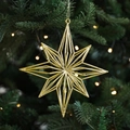 Golden hollow star Christmas ornament hanging on tree, dimensions 16.5cm by 15.8cm - Eight-pointed Star