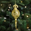 Elegant gold hollow ball Christmas ornament hanging on a tree with soft warm lighting - Screw Shell Style